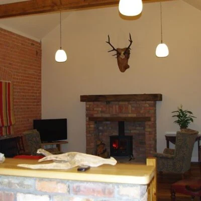 Kilcootry Barn - Kilcootry Barn sitting area with fire place