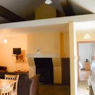An Creagán (2 bedroom) – Tornoge - kitchen area with a dinning area and sitting area with a fire place