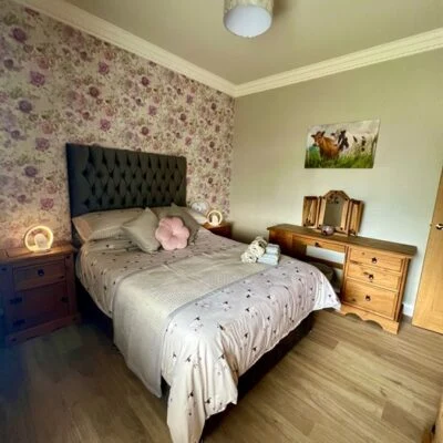 The Myles’ Cottage - bedroom double bed with side tables