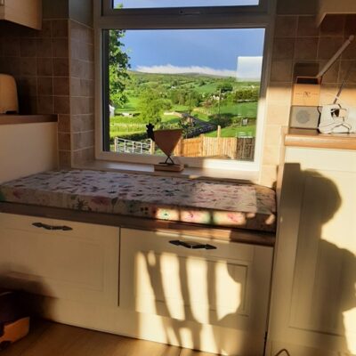 Kingarrow Cottage - window seat with view out of window to garden and countryside